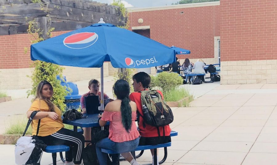 Upperclassmen relish the luxury of being able to eat their lunch outside in the courtyard.