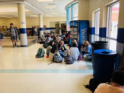 Various students congregate in the halls to enjoy their lunch with friends. (File)