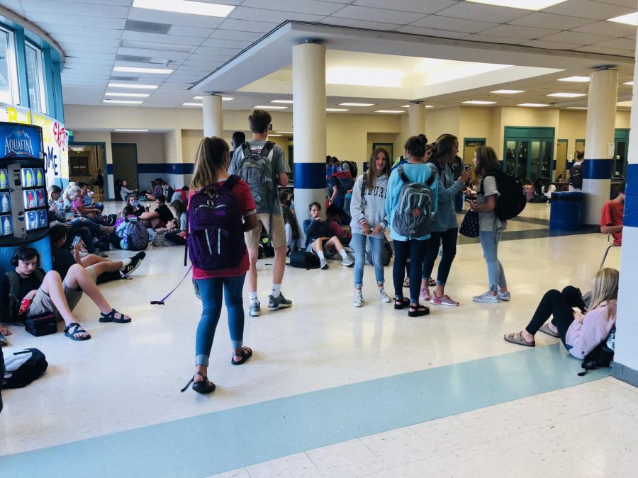 Students walk around the lobby in search of their friends and a place to sit.