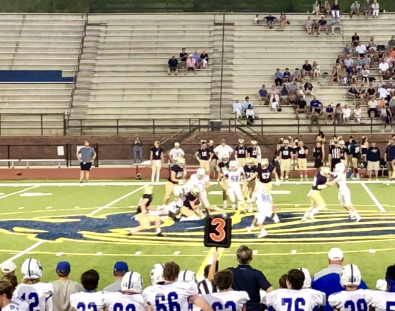 Chelsea football players sack the Briarwood quarter back and prevent them from getting a first down.