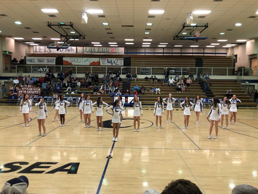 Cheerleaders transition from football to basketball