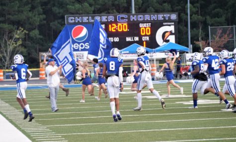 The Hornets take the field prior to the game against Tuscaloosa County.
