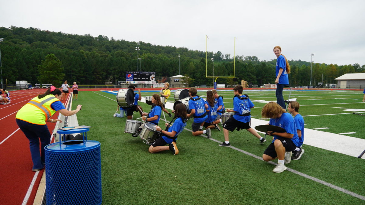 The percussionists playing trains to get ready for the first home game.