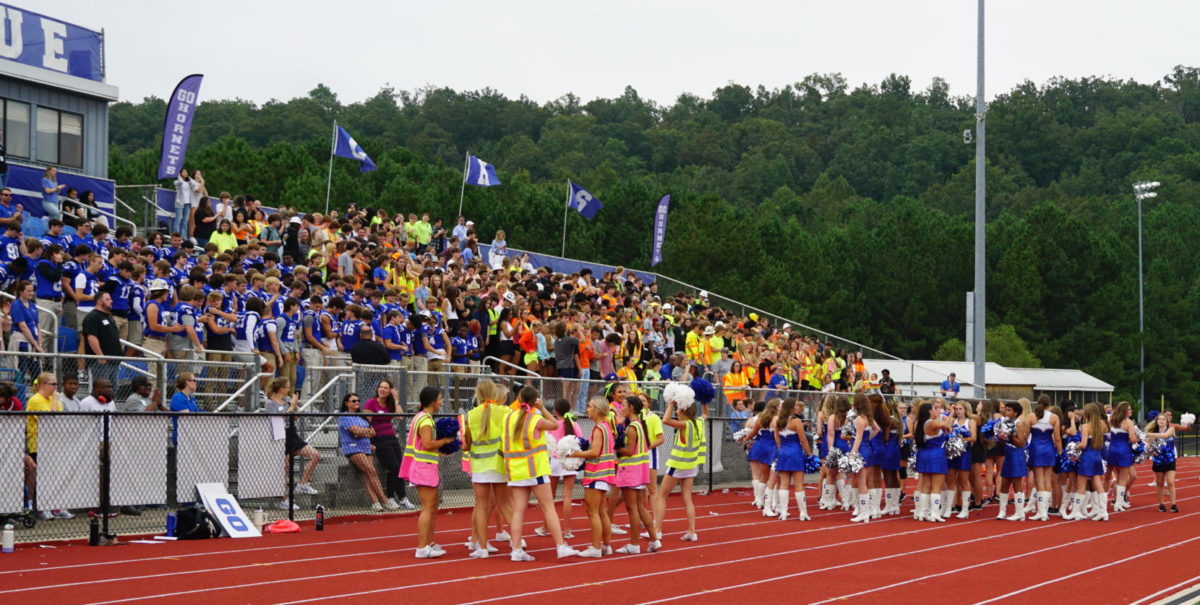 The pep rally was held outdoors in the stadium while the gym is being completed.