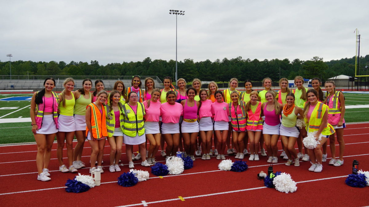 The cheerleaders dressed in neon.