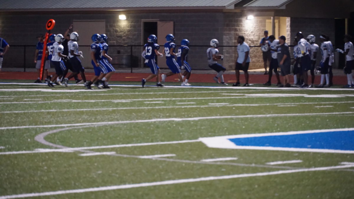 (Back to Front) John Leith, Tryce Wehby, and Kenny Wesley run Calera off the field in an attempt to stop the runner.