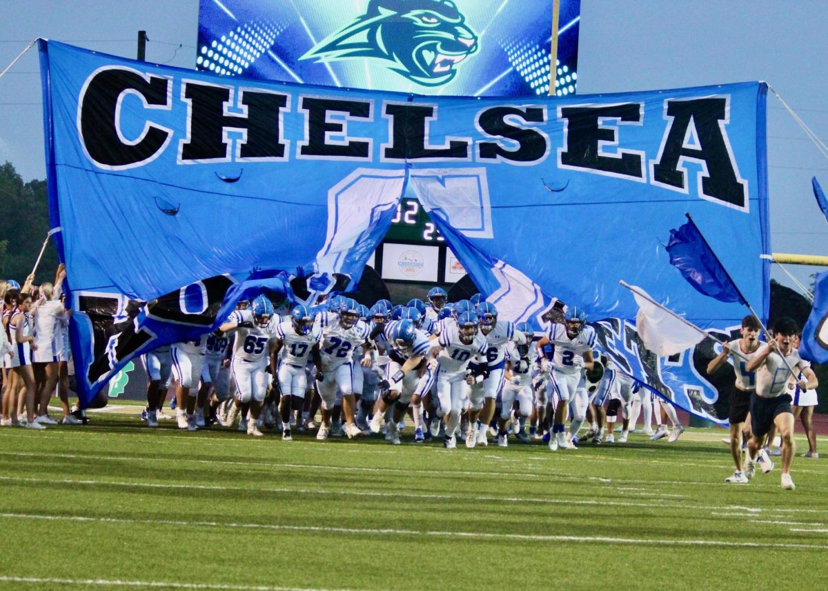 The Chelsea Football team runs out ready to take on Pelham. 